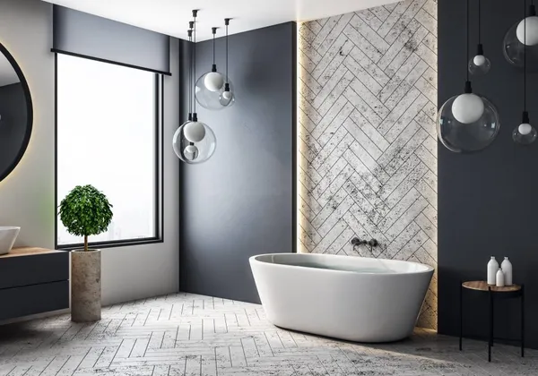 Contemporary bathroom with herringbone tiling and freestanding bath